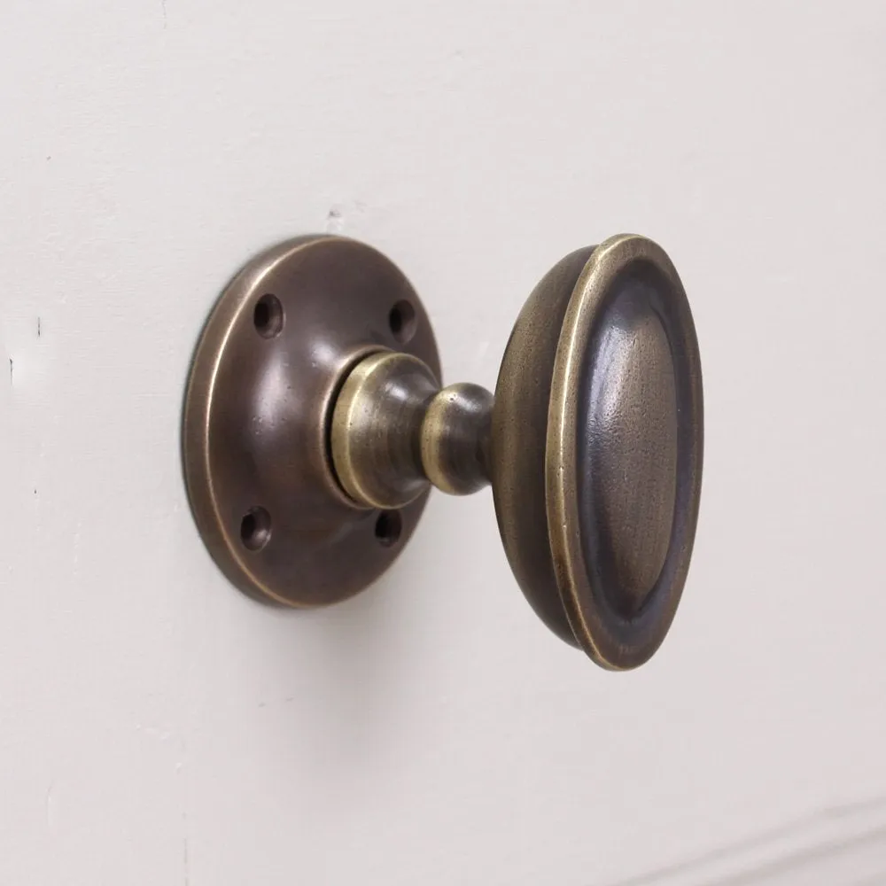 Distressed Antique Brass Oval Edwardian Door Knobs