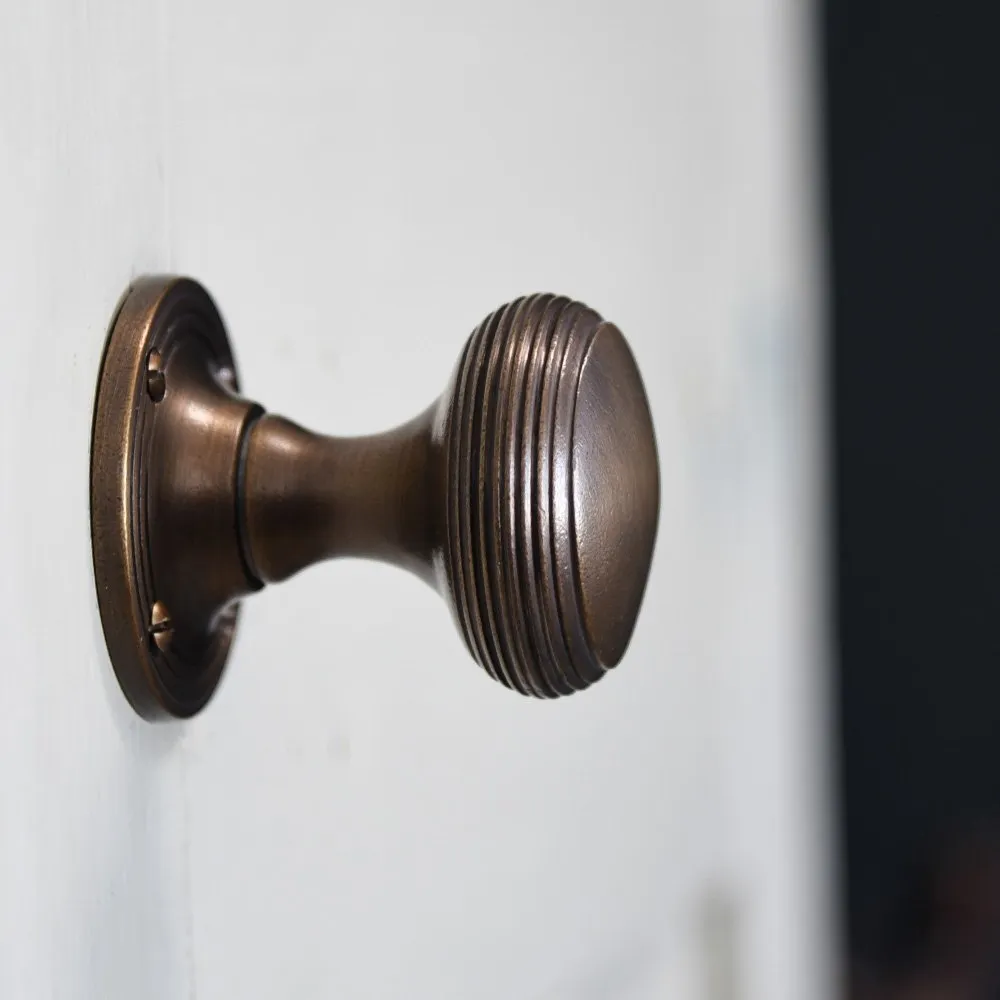 Distressed Antique Brass Reeded Cushion Door Knobs