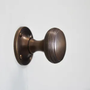 Distressed Antique Brass Reeded Cushion Door Knobs