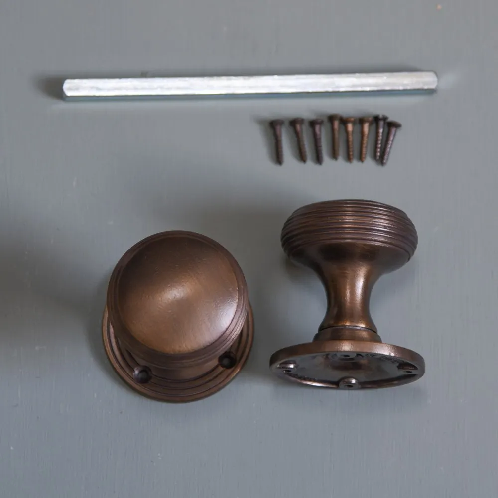 Distressed Antique Brass Reeded Cushion Door Knobs