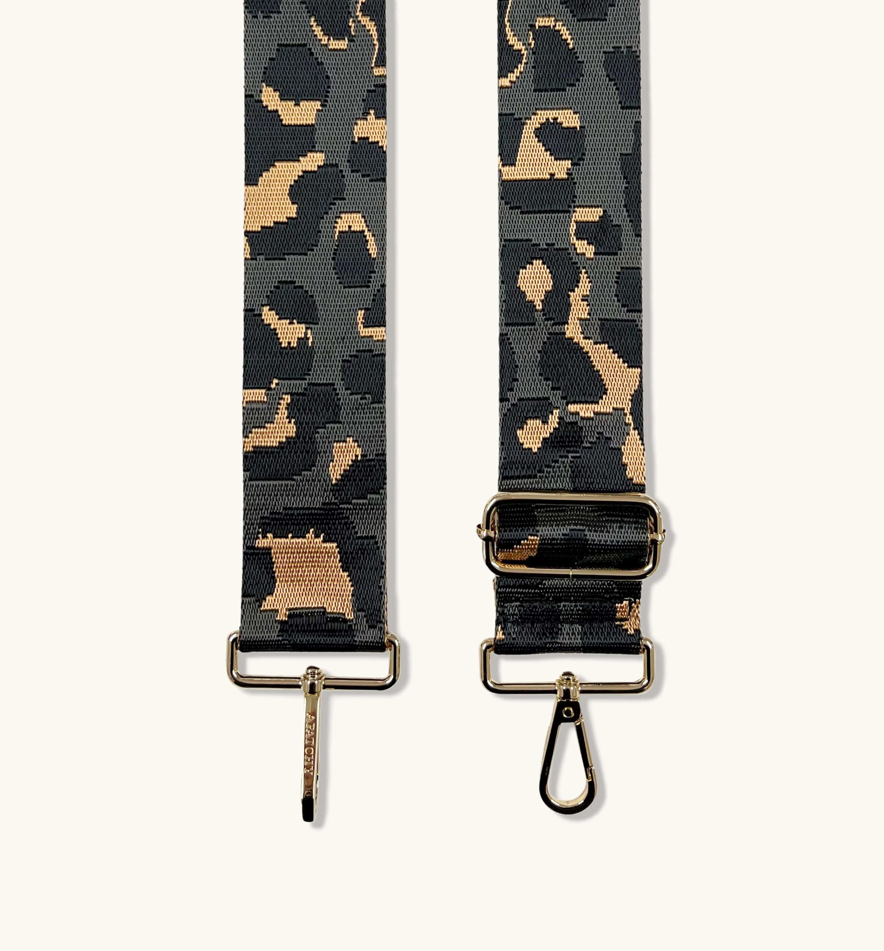 The Tassel Black Leather Crossbody Bag With Grey Leopard Strap